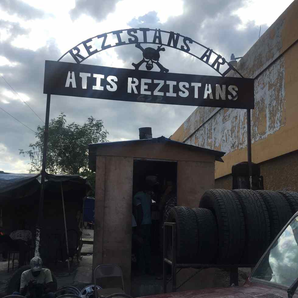 Metal sign reading "Rezistans Art Atis Rezistans"